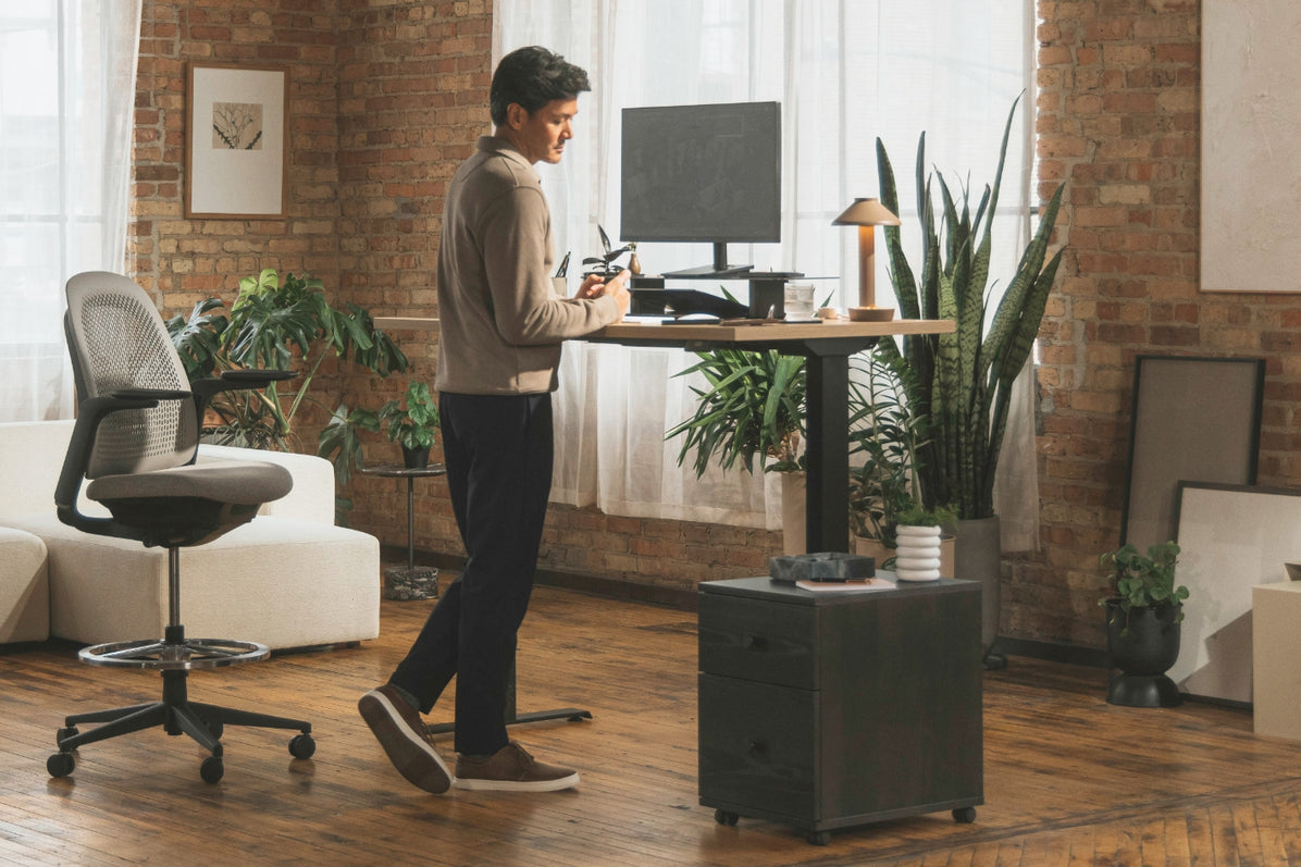 Perk Height-Adjustable Desk in lifestyle shot